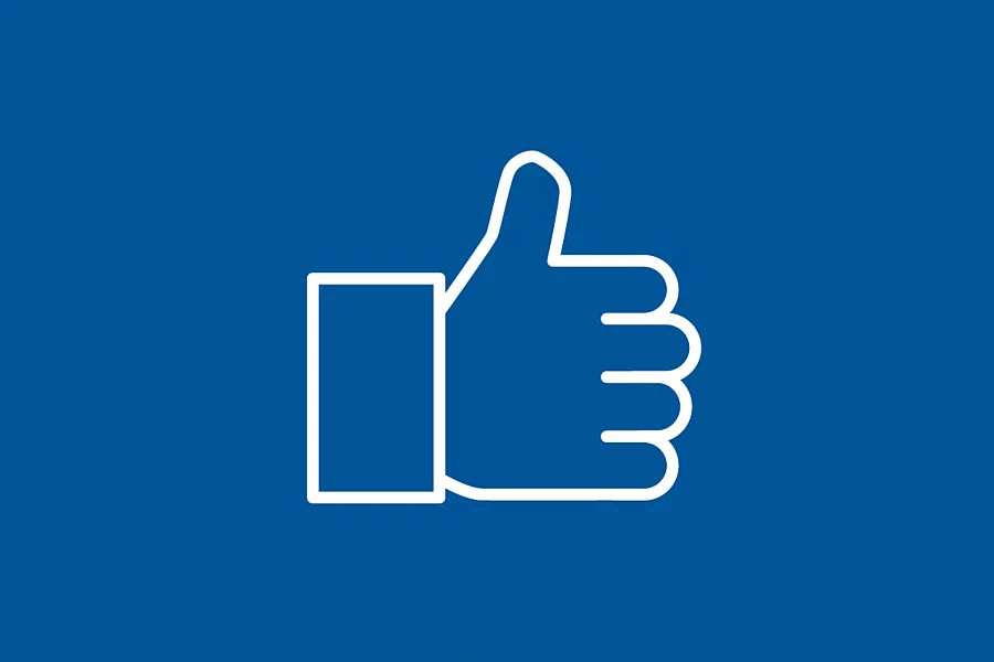 A white icon showing a thumbs-up on a blue background